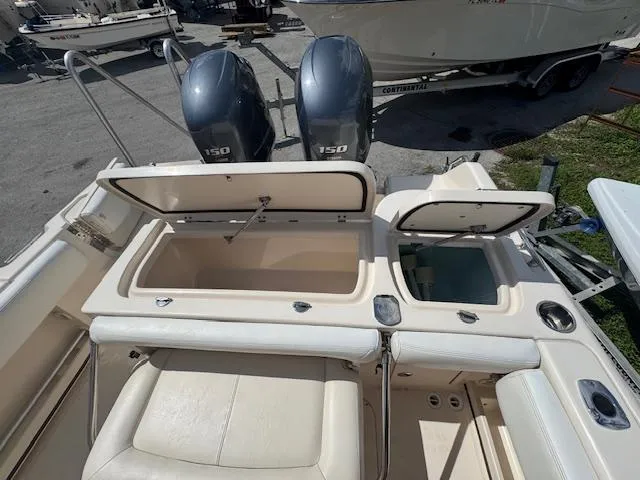 Slide: The Image of 2015 Grady-White Fisherman 257 boat with dual engines and open storage compartments. - 18
