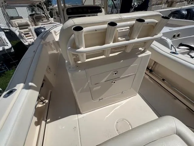 Slide: The Image of 2015 Grady-White Fisherman 257 boat interior with rod holders and storage compartments. - 19