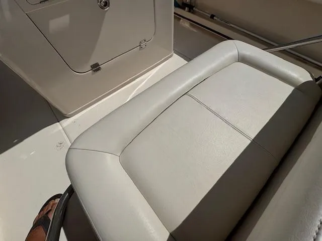 Slide: The Image of 2015 Grady-White Fisherman 257 boat interior with cushioned seating. - 20
