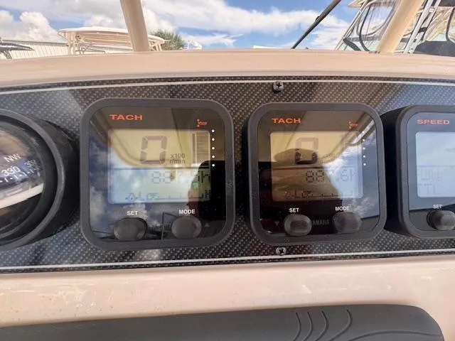 Slide: The Image of Dashboard of 2015 Grady-White Fisherman 257 boat with tachometer displays. - 25