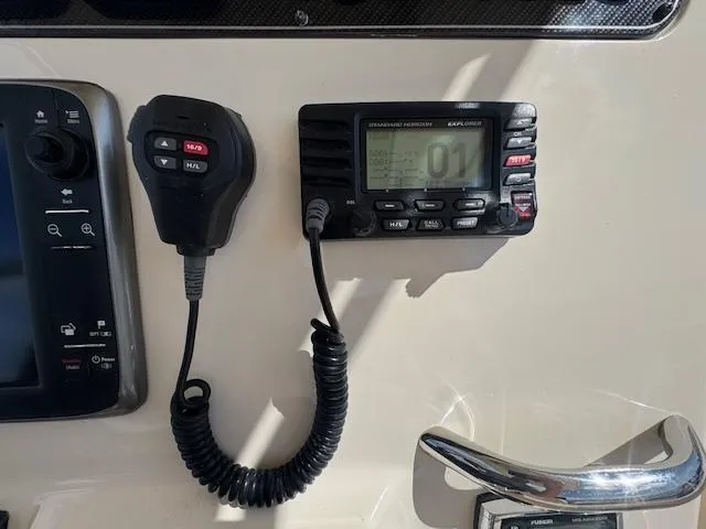 Slide: The Image of 2015 Grady-White Fisherman 257 boat radio and control panel. - 26