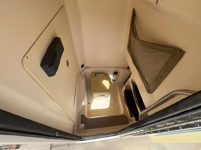 Slide: The Image of 2015 Grady-White Fisherman 257 boat interior cabin with storage and seating. - 30