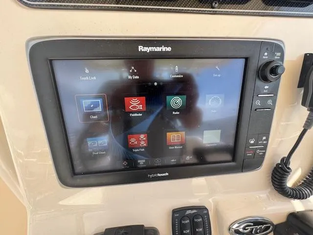 Slide: The Image of Raymarine touchscreen display on 2015 Grady-White Fisherman 257 boat dashboard. - 32