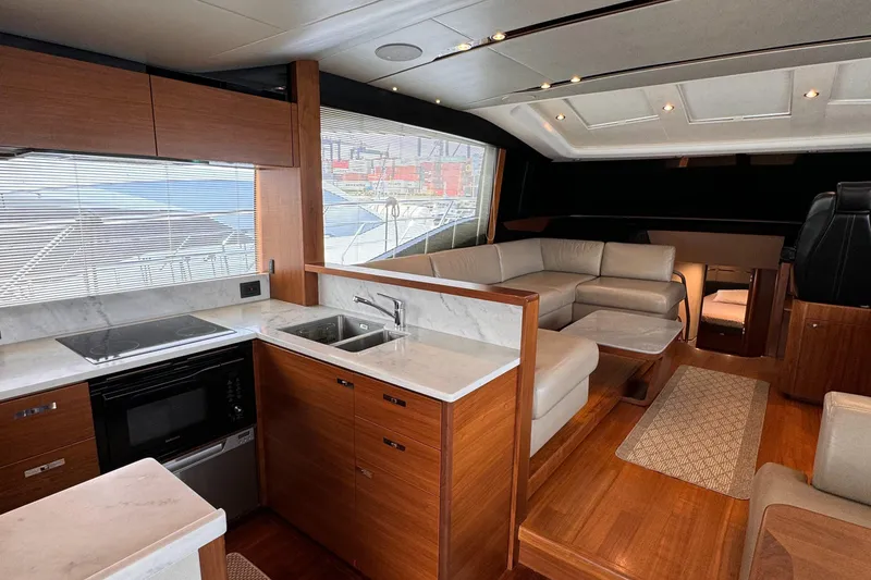 Slide: The Image of Luxurious interior of 2017 Princess S65 yacht with modern kitchen and seating area. - 11