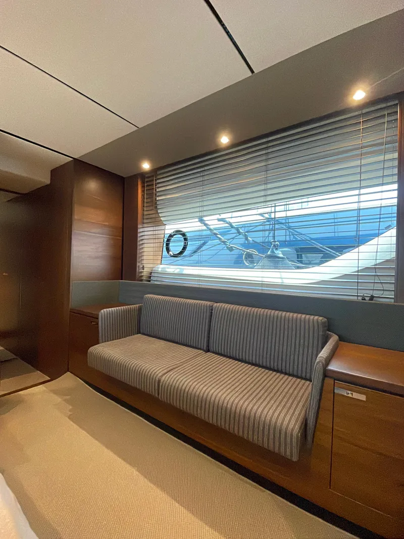 Slide: The Image of Interior of 2017 Princess S65 yacht with striped sofa and large window. - 13