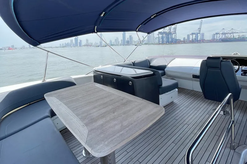 Slide: The Image of Luxury yacht Princess S65 2017 with spacious deck and city skyline view. - 4