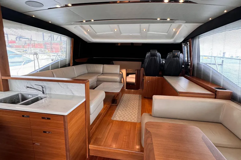 Slide: The Image of Luxurious 2017 Princess S65 yacht interior with elegant wood finishes and plush seating. - 7