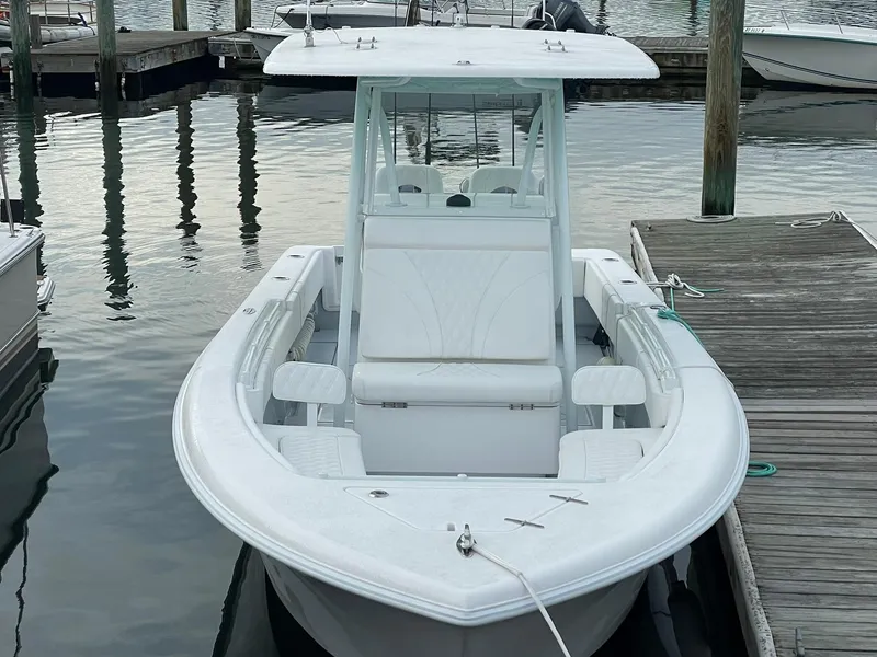 Slide: The Image of 2024 Contender 28 Tournament boat docked at marina, front view. - 4