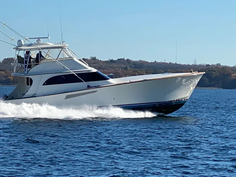 Slide: The Image of 1999 Hines-Farley SPORTFISHERMAN yacht cruising on open water. - 1