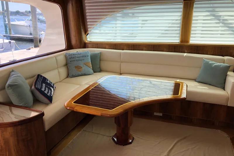 Slide: The Image of Luxurious 1999 Hines-Farley SPORTFISHERMAN yacht interior with elegant seating and wooden table. - 11