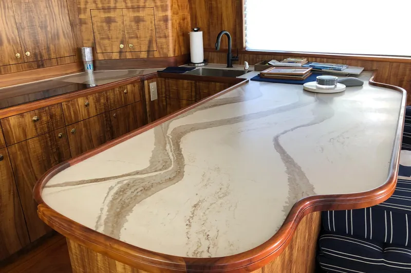 Slide: The Image of Luxurious kitchen interior of a 1999 Hines-Farley SPORTFISHERMAN yacht with elegant wood cabinetry. - 15