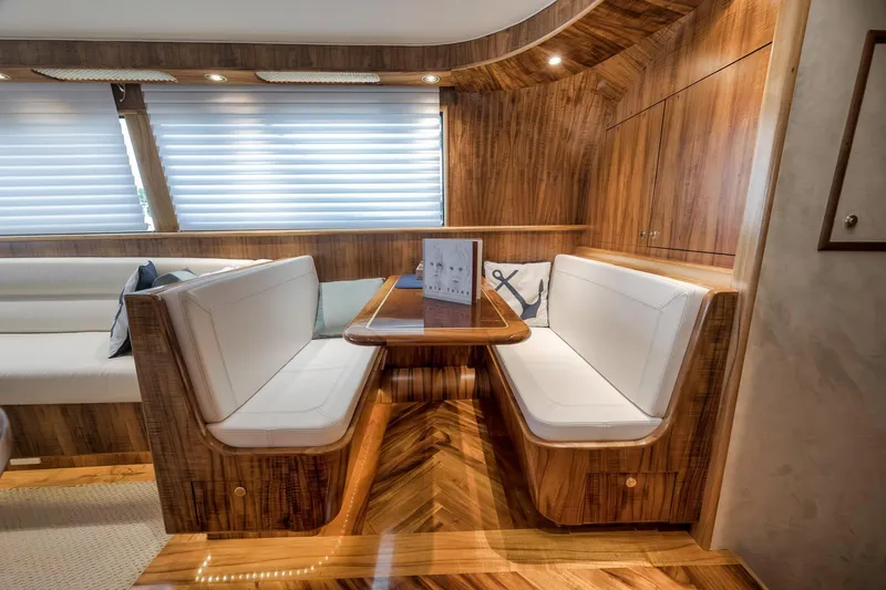 Slide: The Image of Luxurious 1999 Hines-Farley SPORTFISHERMAN yacht interior with elegant wood finish and cozy seating. - 28