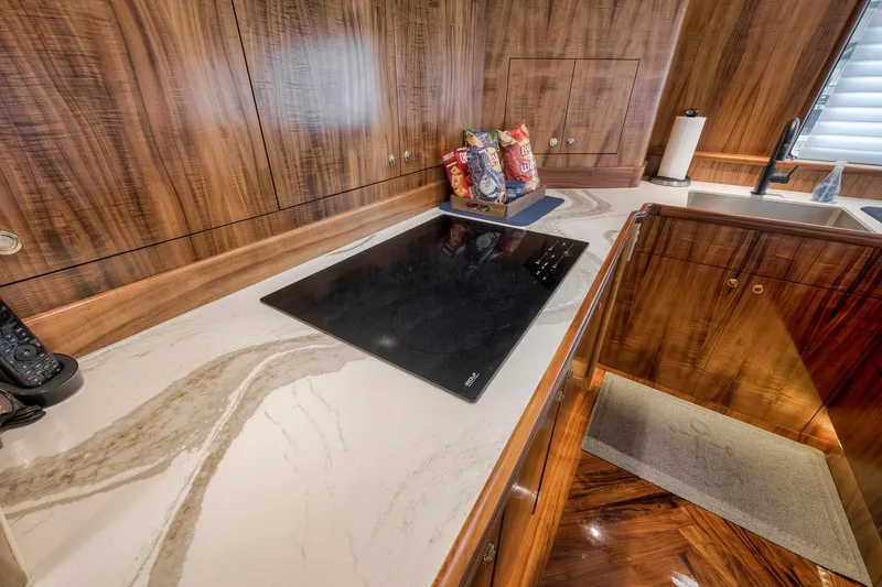 Slide: The Image of Luxurious kitchen interior of 1999 Hines-Farley SPORTFISHERMAN yacht with modern cooktop. - 29