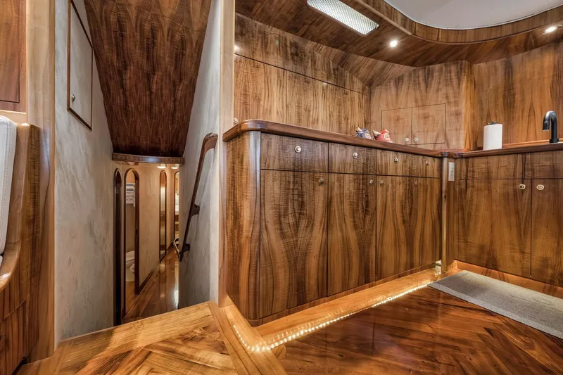 Slide: The Image of Luxurious wood interior of 1999 Hines-Farley SPORTFISHERMAN yacht, featuring elegant cabinetry and lighting. - 32