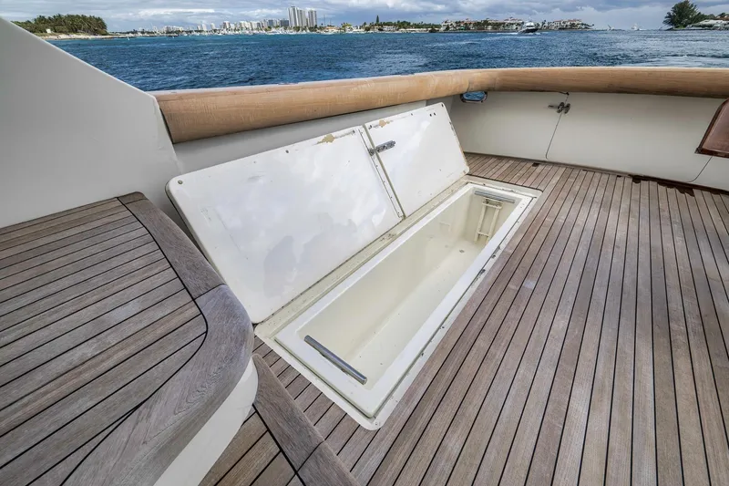 Slide: The Image of 1999 Hines-Farley SPORTFISHERMAN yacht deck with open storage compartment, ocean view. - 38