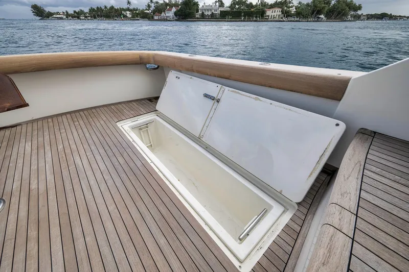 Slide: The Image of 1999 Hines-Farley SPORTFISHERMAN boat deck with open storage compartment, ocean view. - 39