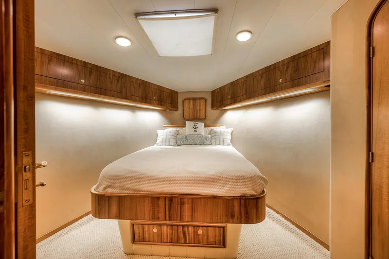 Slide: The Image of Luxurious cabin interior of 1999 Hines-Farley SPORTFISHERMAN yacht with cozy bed and wood accents. - 59