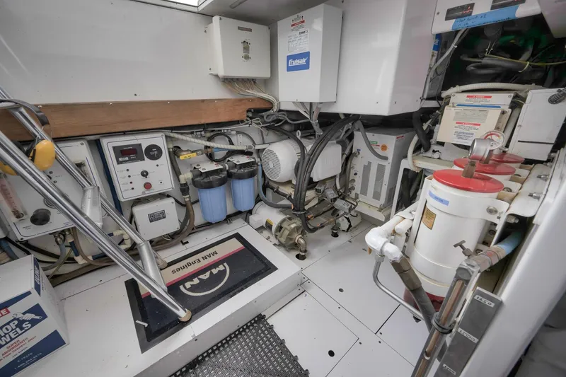 Slide: The Image of Engine room of 1999 Hines-Farley SPORTFISHERMAN with mechanical equipment and control panels. - 66