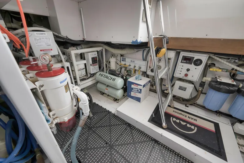Slide: The Image of Engine room of 1999 Hines-Farley SPORTFISHERMAN with equipment and control panels. - 67