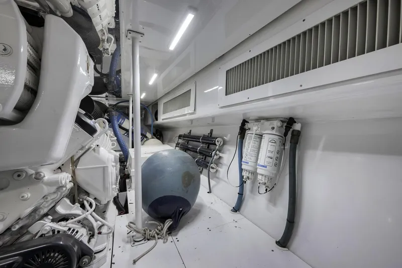 Slide: The Image of Engine room of 1999 Hines-Farley SPORTFISHERMAN with mechanical components and equipment. - 74