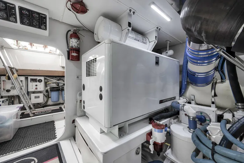 Slide: The Image of Engine room of 1999 Hines-Farley SPORTFISHERMAN with generator and equipment. - 79