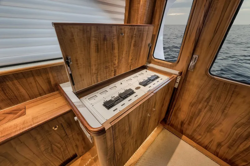 Slide: The Image of 1999 Hines-Farley SPORTFISHERMAN yacht interior with elegant wood paneling and ocean view. - 81