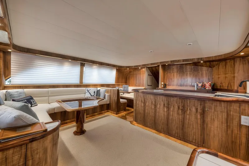 Slide: The Image of Luxurious interior of 1999 Hines-Farley SPORTFISHERMAN yacht with wood finish and plush seating. - 82
