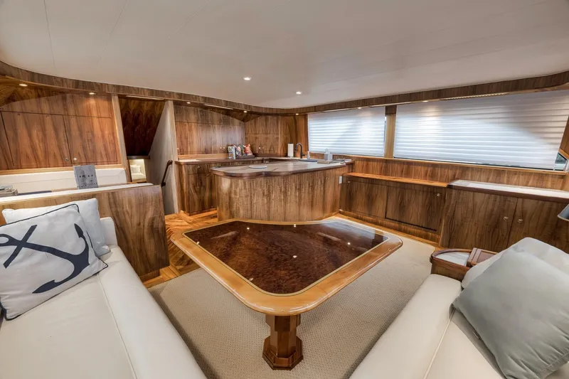 Slide: The Image of Luxurious interior of 1999 Hines-Farley SPORTFISHERMAN yacht with elegant wood finishes and cozy seating. - 84