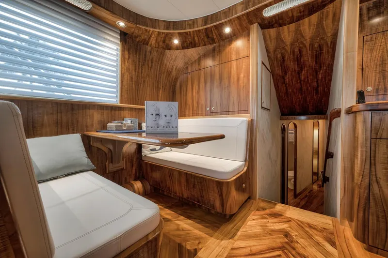 Slide: The Image of Luxurious 1999 Hines-Farley SPORTFISHERMAN yacht interior with elegant wood finish and cozy seating area. - 89
