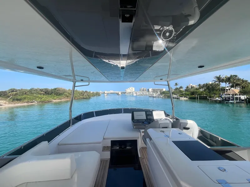 Slide: The Image of 2024 Aicon 66 Vivere yacht cruising on clear blue waters. - 11
