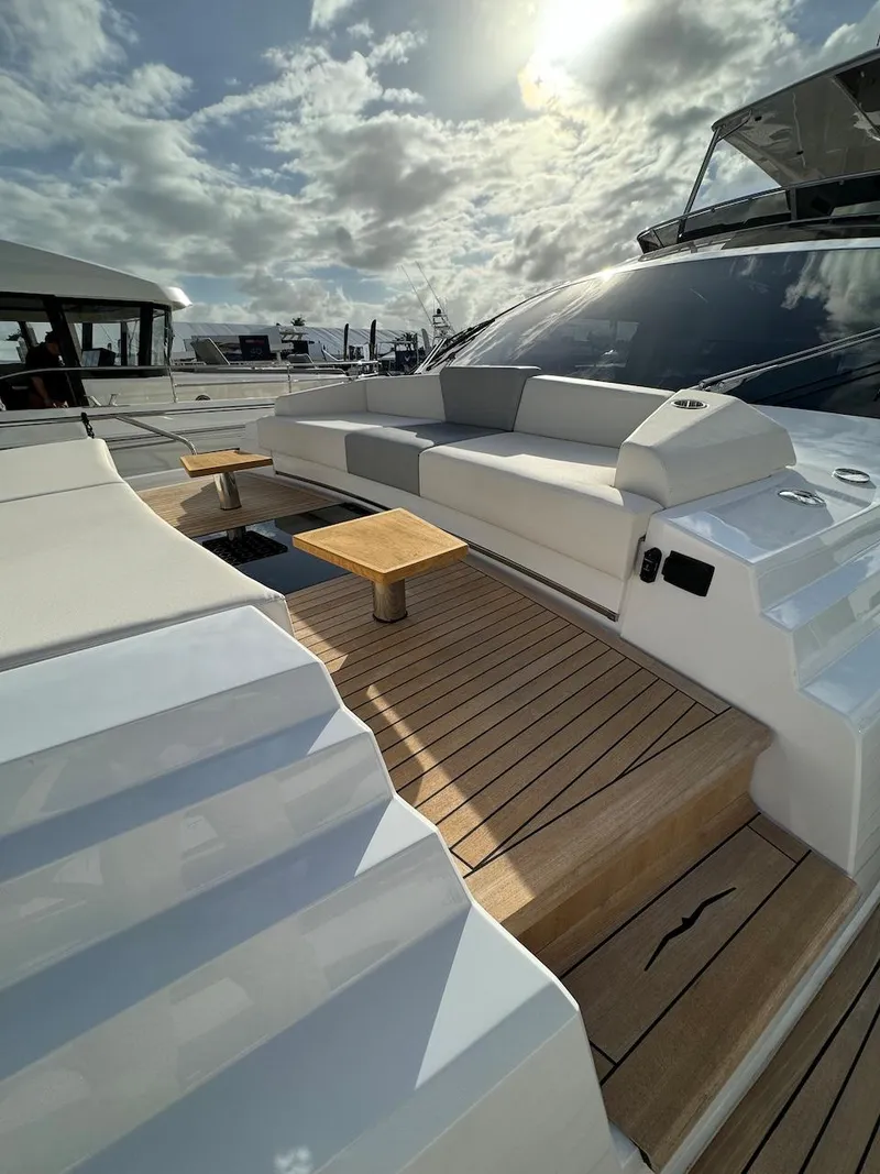 Slide: The Image of Luxurious 2024 Aicon 66 Vivere yacht deck with elegant seating and wooden flooring. - 12