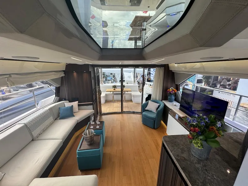 Slide: The Image of Luxurious interior of 2024 Aicon 66 Vivere yacht with modern furnishings and panoramic windows. - 15