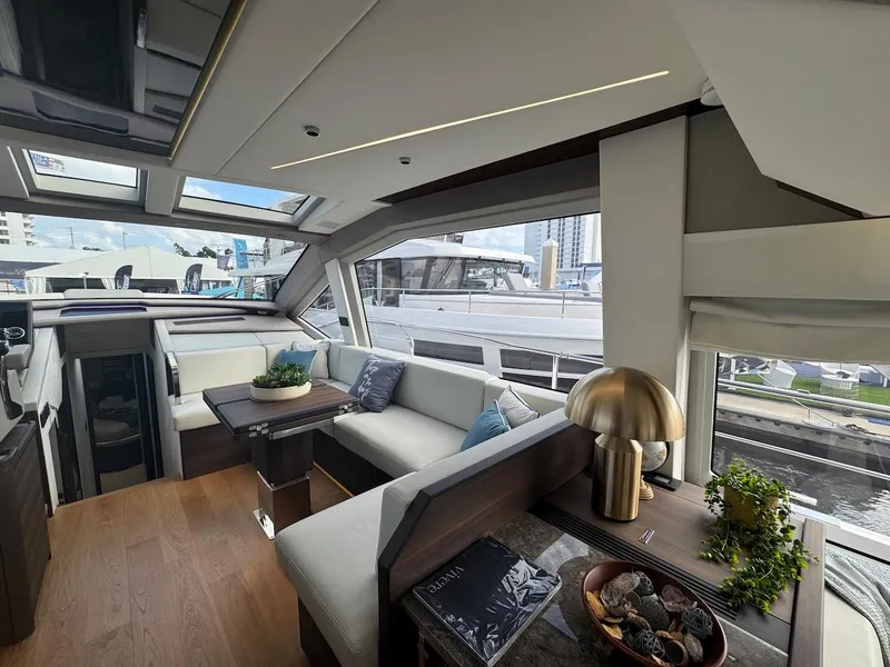 Slide: The Image of Luxurious interior of 2024 Aicon 66 Vivere yacht with modern decor and panoramic windows. - 18