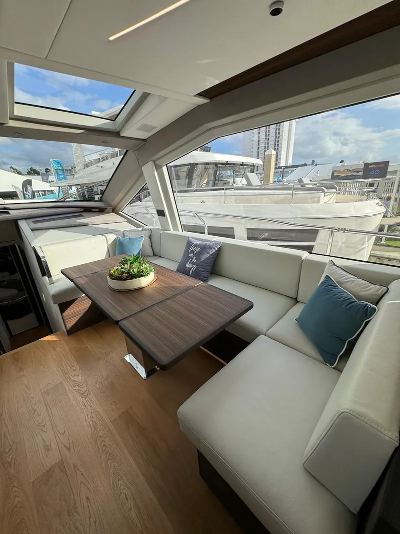 Slide: The Image of Luxurious interior of 2024 Aicon 66 Vivere yacht with elegant seating and table. - 25