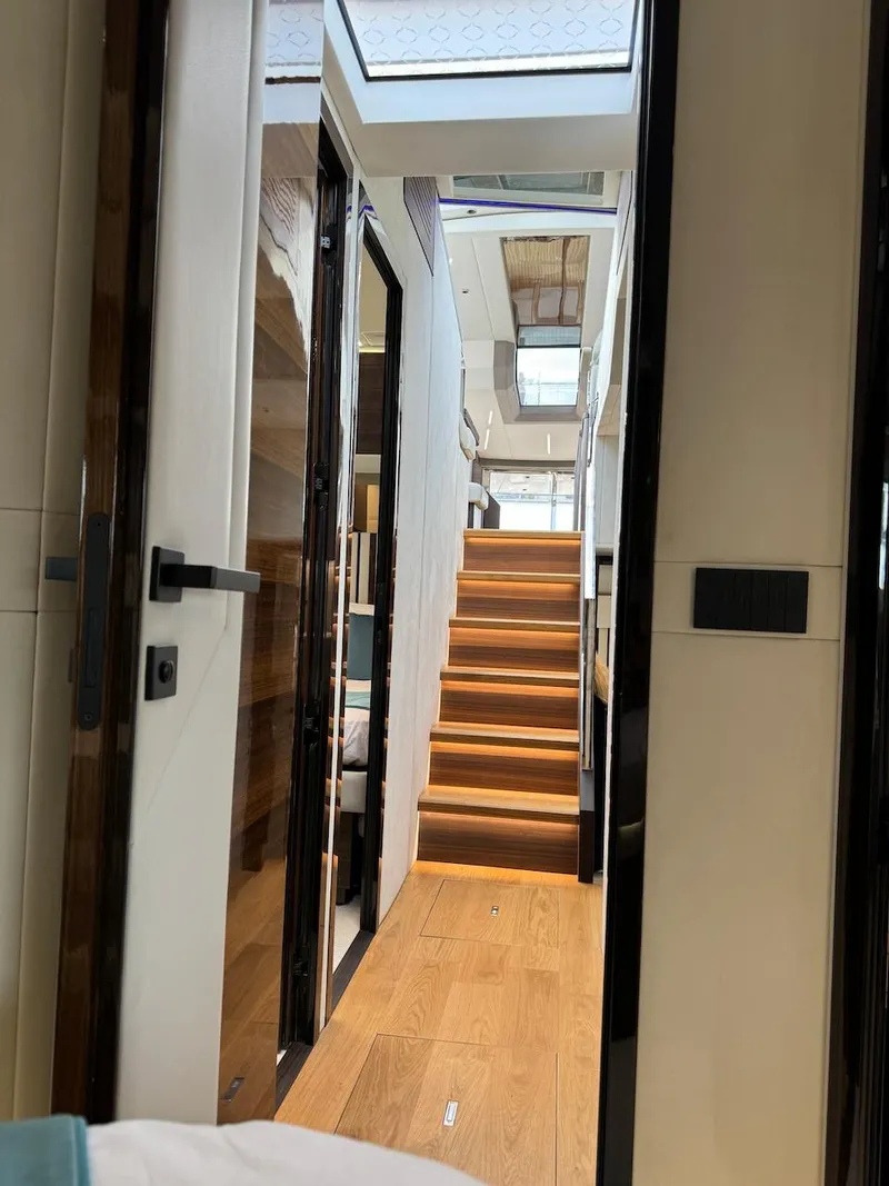Slide: The Image of Interior view of 2024 Aicon 66 Vivere yacht with modern staircase and skylight. - 38
