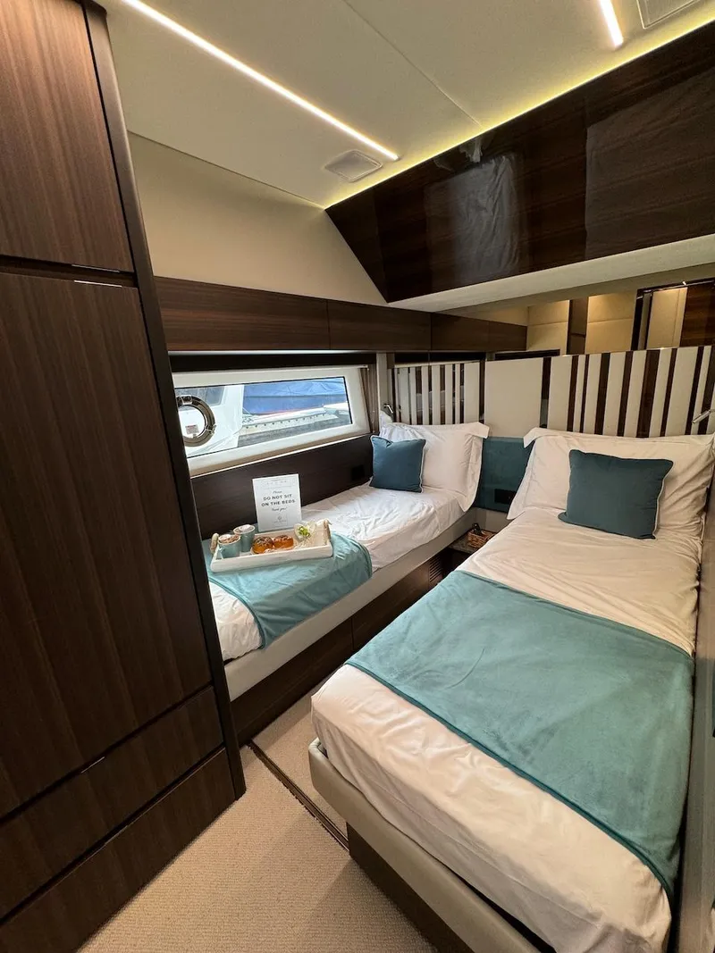 Slide: The Image of Luxurious 2024 Aicon 66 Vivere yacht cabin with twin beds and elegant decor. - 39