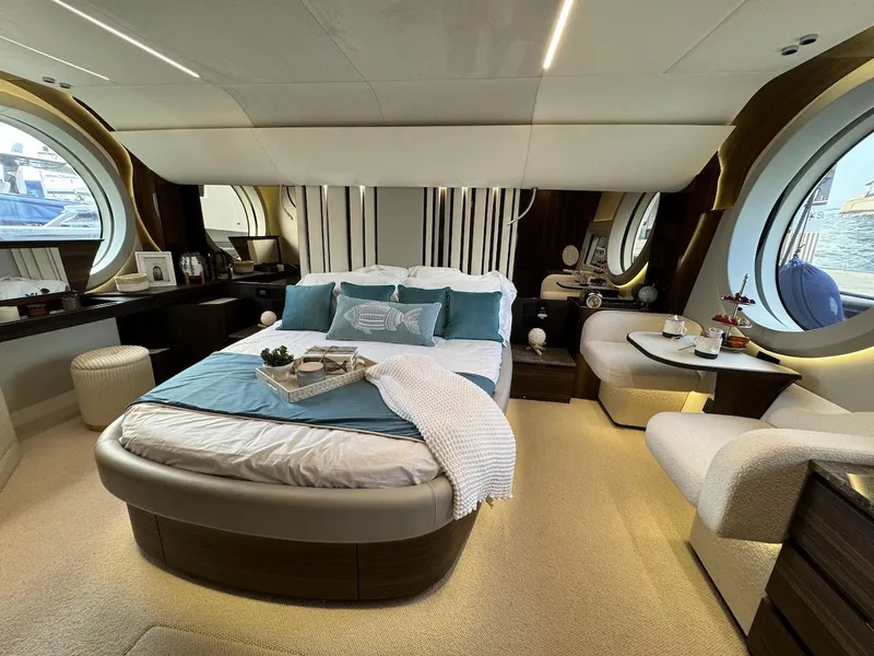 Slide: The Image of Luxurious bedroom interior of 2024 Aicon 66 Vivere yacht with elegant decor and round windows. - 43