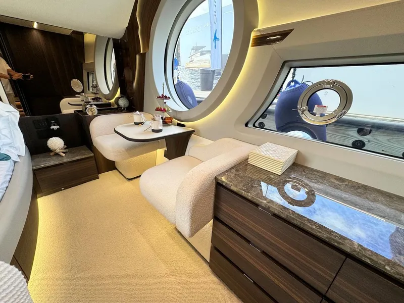 Slide: The Image of Luxurious interior of 2024 Aicon 66 Vivere yacht with elegant seating and large windows. - 44