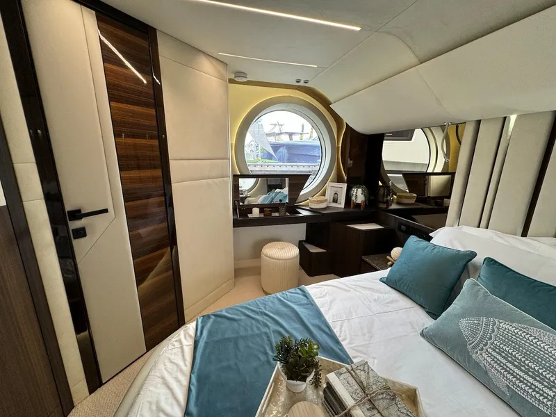Slide: The Image of Luxurious 2024 Aicon 66 Vivere yacht bedroom with elegant decor and round window view. - 45
