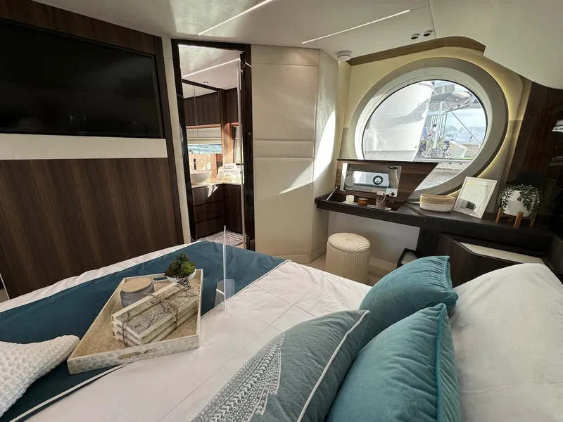 Slide: The Image of Luxurious interior of 2024 Aicon 66 Vivere yacht with elegant bedroom and scenic window view. - 49