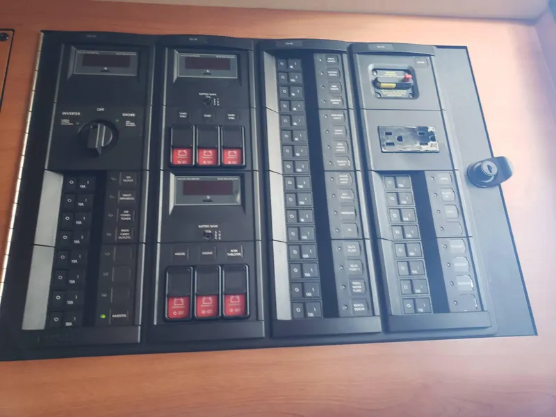 Slide: The Image of Control panel of 2016 Mystic Powerboats M4200 with switches and gauges. - 10