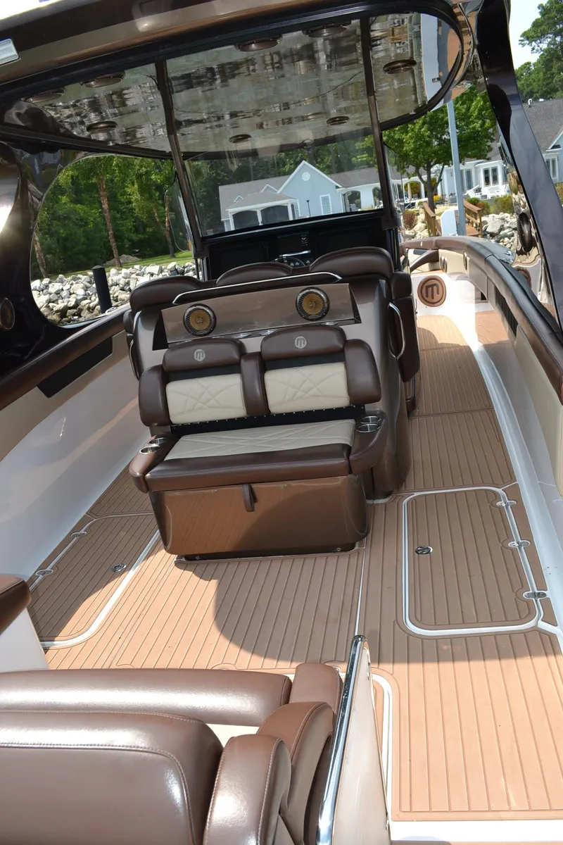 Slide: The Image of 2016 Mystic Powerboats M4200 interior with luxurious seating and sleek design. - 11