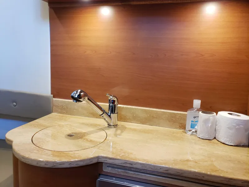 Slide: The Image of Luxurious 2016 Mystic Powerboats M4200 interior with elegant sink and countertop. - 6