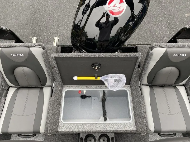 Slide: The Image of 2025 Lund 1775 Impact XS Sport boat interior with seating and storage. - 13