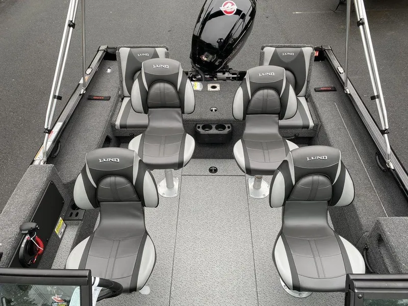 Slide: The Image of 2025 Lund 1775 Impact XS Sport boat interior with six gray seats. - 14