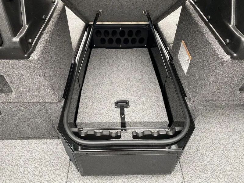 Slide: The Image of 2025 Lund 1775 Impact XS Sport boat storage compartment, open and empty. - 9