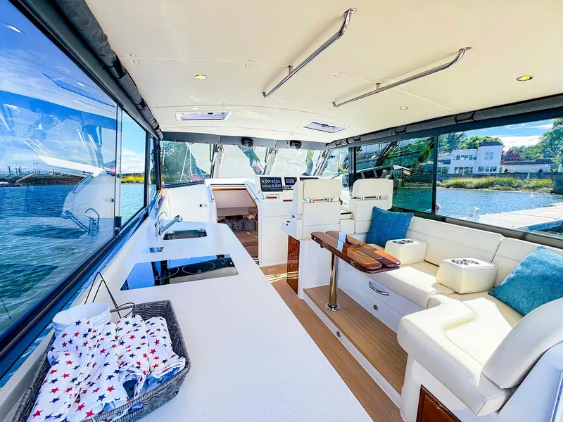 Slide: The Image of Luxurious 2024 MJM 4 yacht interior with elegant seating and scenic water views. - 16