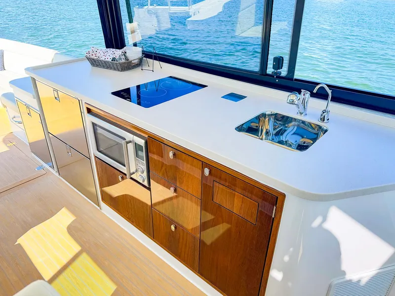 Slide: The Image of Luxurious 2024 MJM 4 yacht kitchen with modern appliances and ocean view. - 19