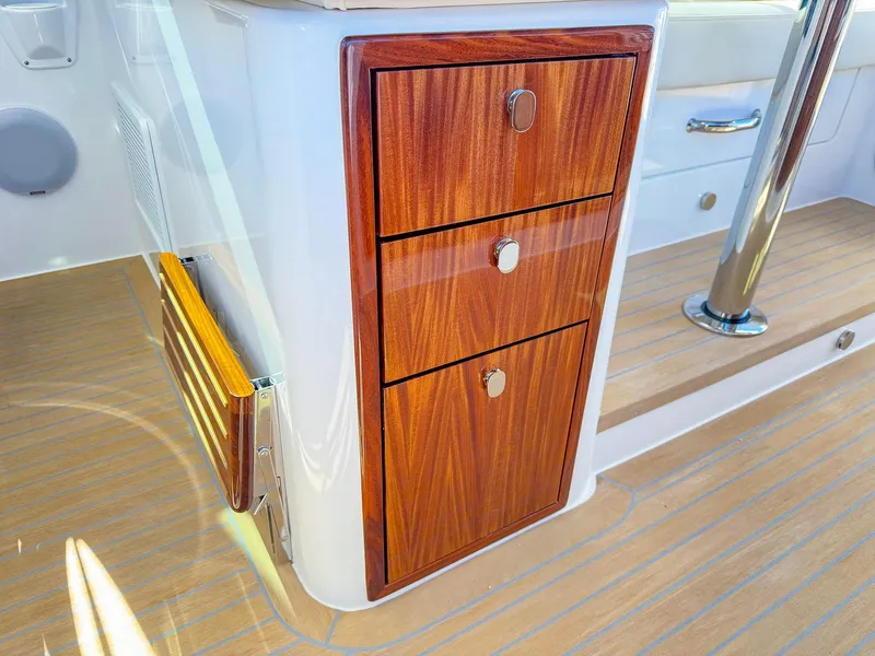 Slide: The Image of 2024 MJM 4 boat interior with wooden drawers and sleek design. - 25