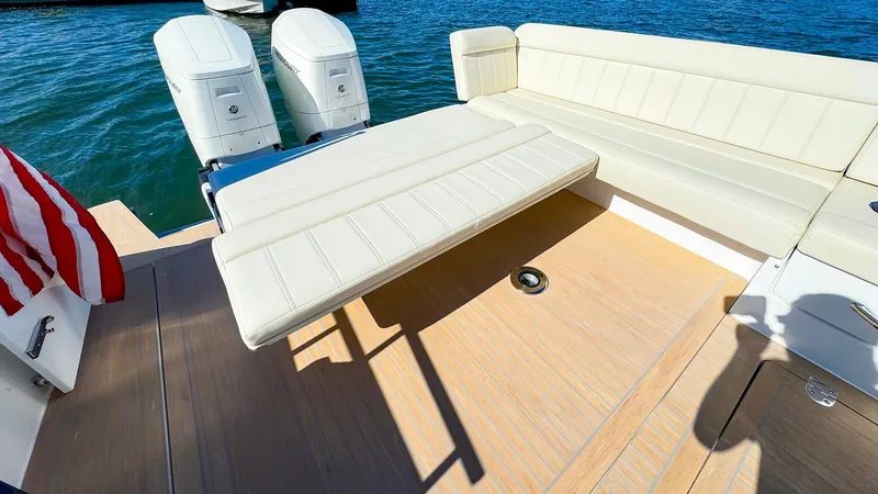 Slide: The Image of 2024 MJM 4 boat with dual engines and spacious seating on deck. - 28